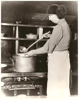 The First Lady of New York ladles out soup during one of her visits to a social welfare institution, feeding those hit hard by the 1929 Wall Street crash. (FDRL)