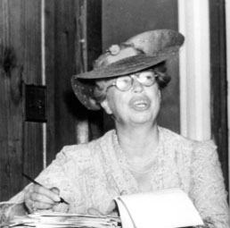 Eleanor Roosevelt signing some typed correspondence. (floridamemory.com)
