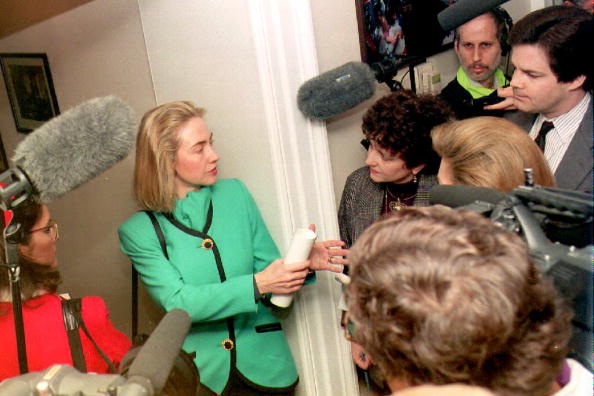 Hillary Clinton speaks to reporters in the hallway outside of her West Wing office. (Getty)