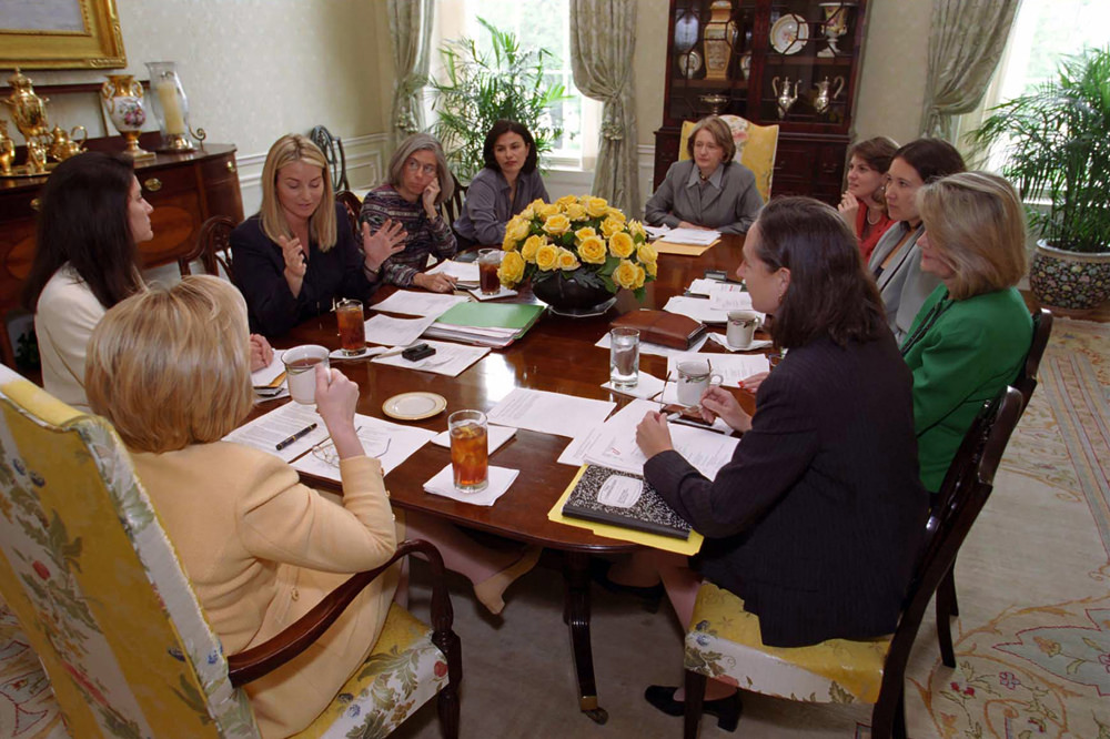 Hillary Clinton conducting a staff meeting with members of "Hillaryland." (firstladies.org)