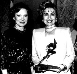 In December 1992, Hillary Clinton presented Rosalynn Carter with a humanitarian award named after Eleanor Roosevelt. (Washington Post)