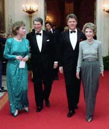 Ronald and Nancy Reagan walk down the White House Cross Hall with then-Governor Bill Clinton and Hillary Clinton, 1982. (RRPL)