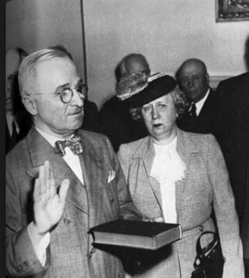 Bess Truman witnessing the swearing-in of her husband as president in the White House Cabinet Room, following the death of President Roosevelt. (pinterest.com)