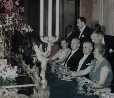 Bess Truman presiding at a state dinner. (HSTL)