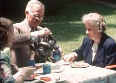 Harry, Bess and Margaret Truman breakfasting together on their back lawn, home in Missouri. (HSTL)