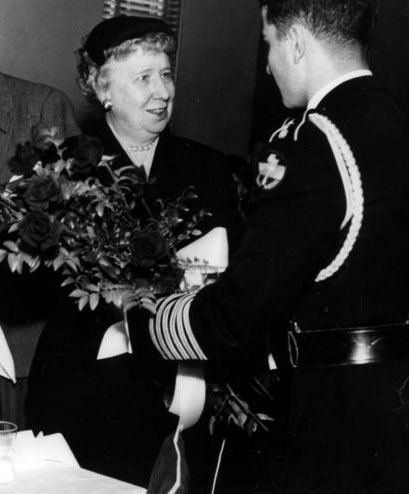 Bess Truman accepts flowers from a U.S. serviceman.  (HSTL)